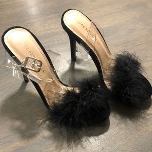 Small black heels with faux feather strap and wrap PVC strap.